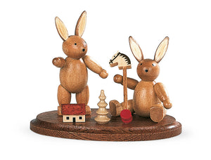 Two bunnies, children playing