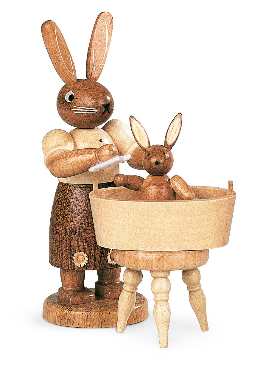 Easter bunny, female with little child have a bath