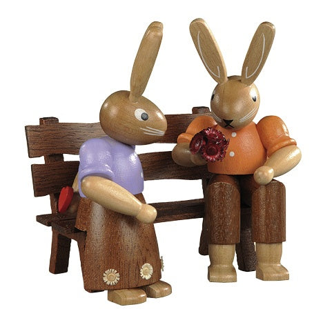 Easter bunny, couple on garden bench